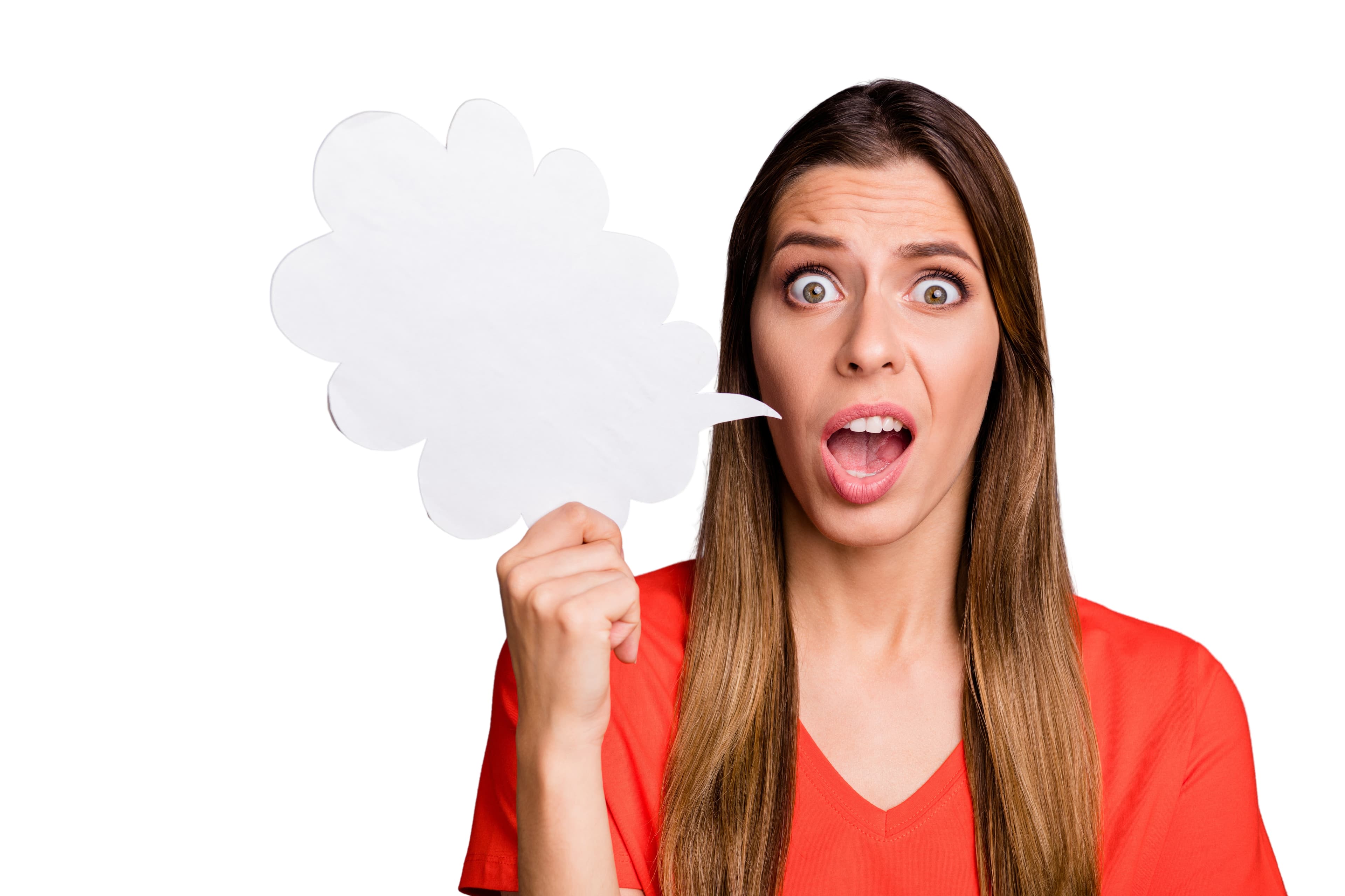 A surprised woman in a red top holding up a blank white speech bubble